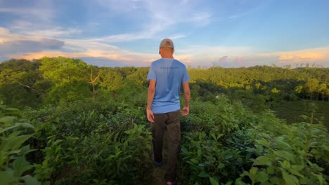 A-young-man-walking-through-the-wilderness-in-Southern-Asia-Bangladesh