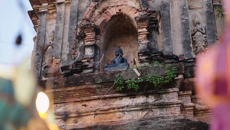 ancient thai temple ruins with buddha statue
