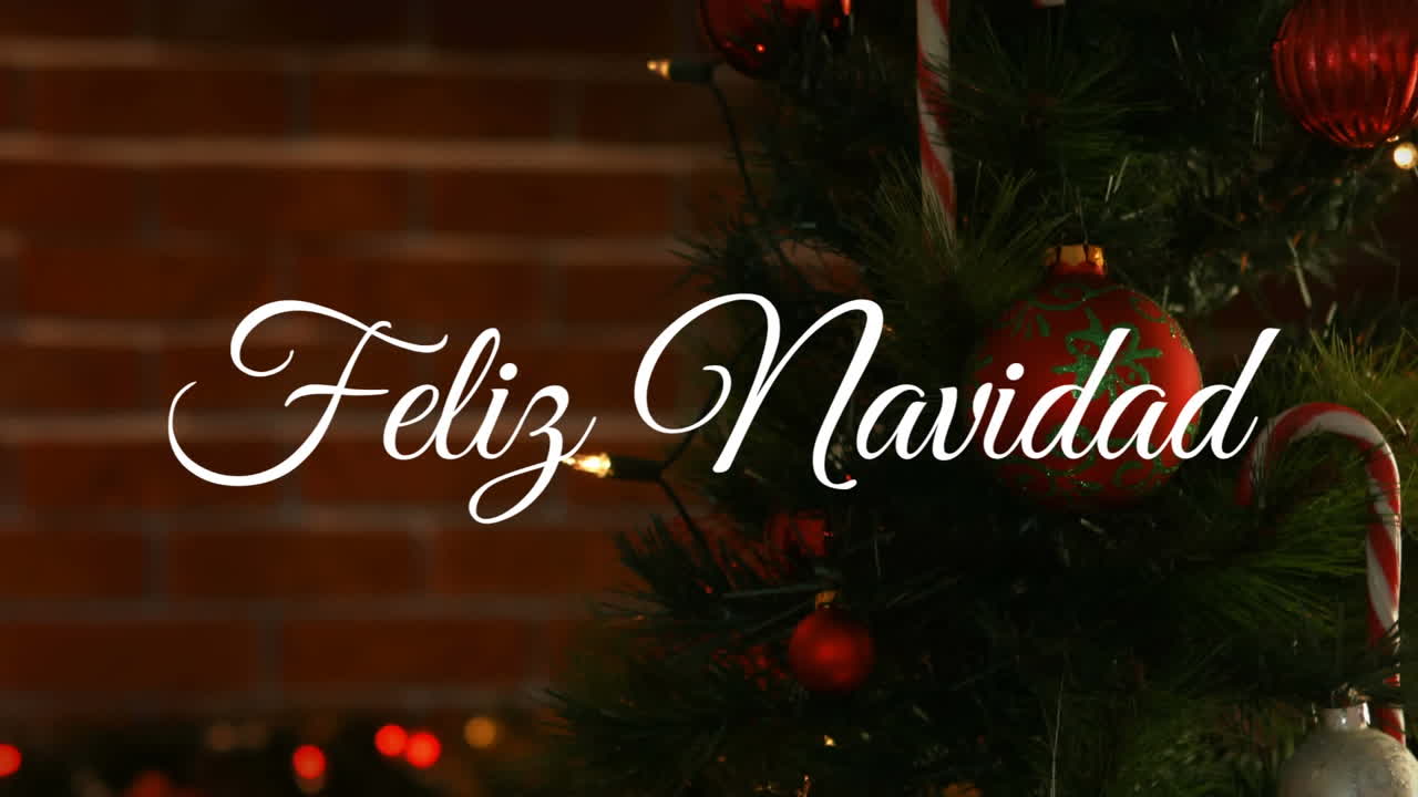 animación de felicitaciones navideñas españolas sobre el árbol de navidad con bolas