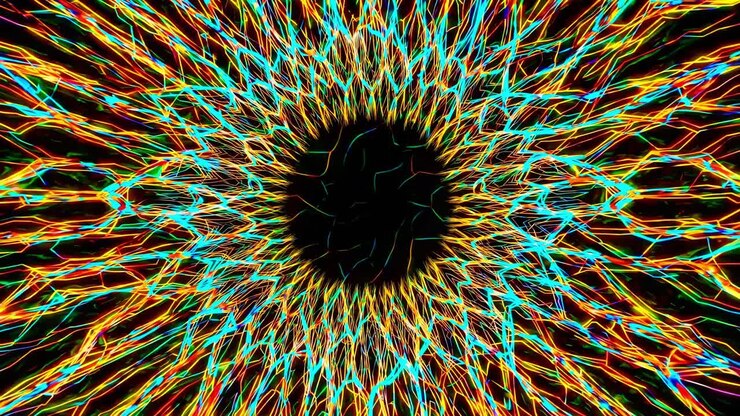 Colorful lines create a mesmerizing, abstract animation, radiating outwards from a central dark circle, resembling a cybernetic iris or a complex neural network