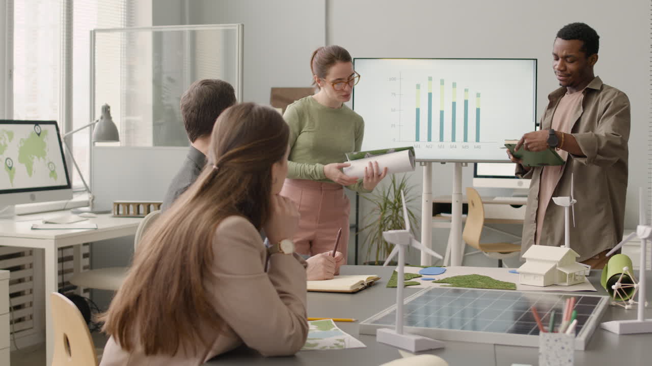 Multiethnic Business Team Discussing About Wind Energy Project In The Office 1
