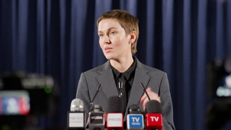 female politician talking with tv reporters