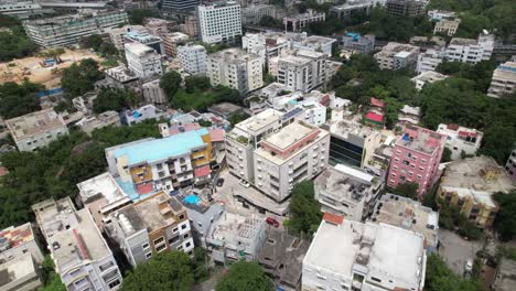 4K-Aerial-night-video-of-Banjara-Hills,-Irram-Manzil-Colony,-Khairtabad,-is-an-urban-commercial-centre-and-one-of-the-most-affluent-neighbourhoods-in-Hyderabad,-Telangana,-India