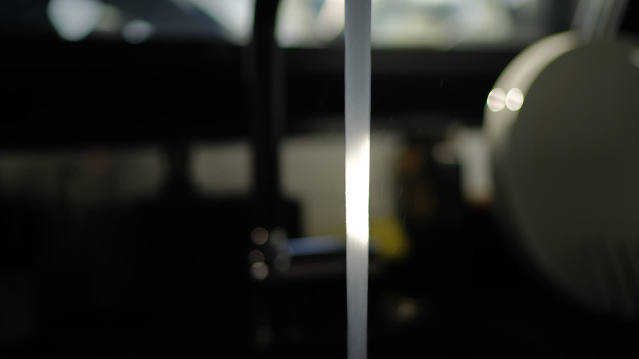 Woman opening modern faucet and letting fresh water flow