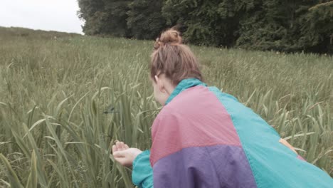 pretty girl holding dragonfly