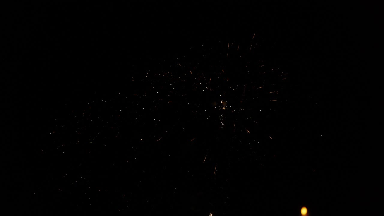 Fireworks twinkle and burst in the night sky in a dazzling display at a prestigious festival closing ceremony