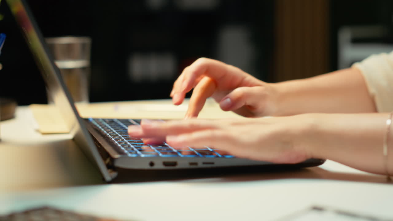 Vertical Video Close up of woman spends the night transcribing key points