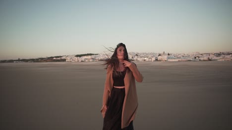 Tender-woman-on-seashore-on-windy-day