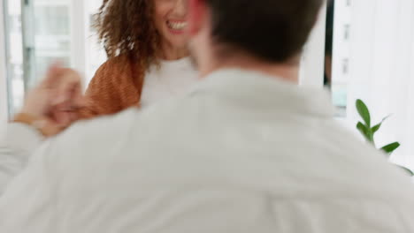 Couple,-home-and-dancing-in-living-room