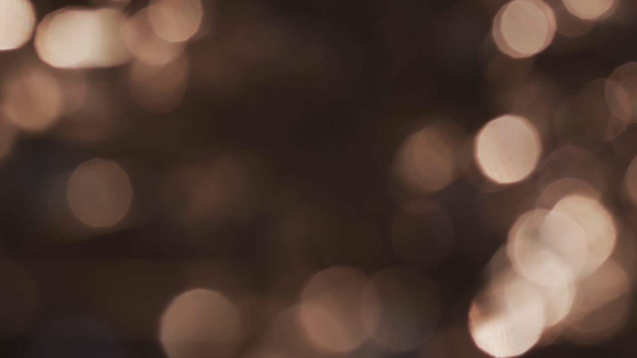 video de puntos de luz bokeh amarillos parpadeantes con espacio de copia