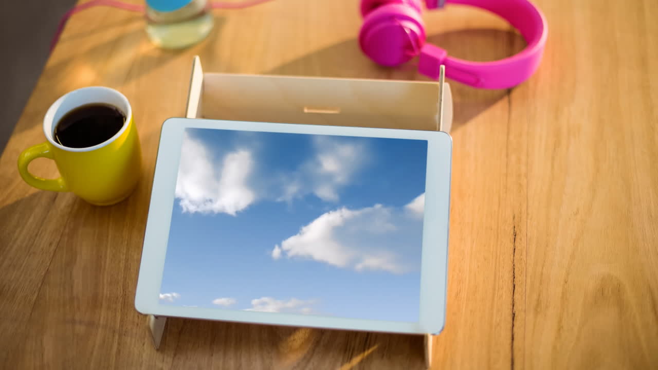 Blue sky and clouds on tablet screen