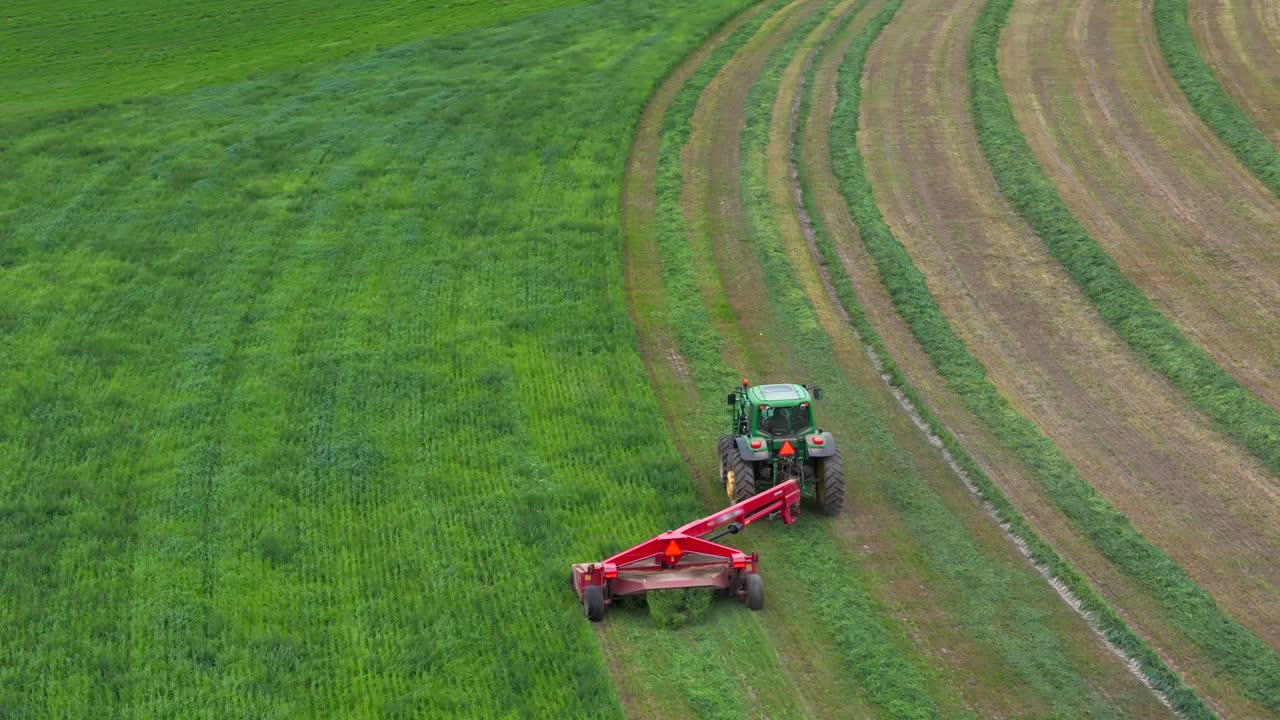 Circular Crop Care: A Bird's-Eye Perspective of a Green Tractor at Work in British Columbia