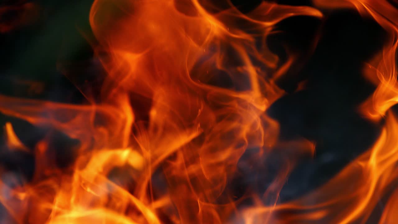 Bonfire burning at night. Burning logs in orange flames. Fire flame