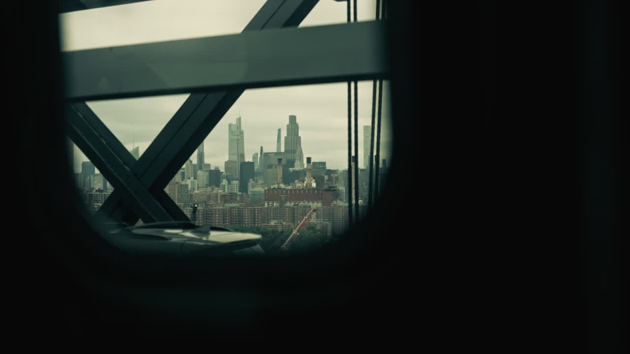 Framed View of a City Skyline from a Moving Perspective