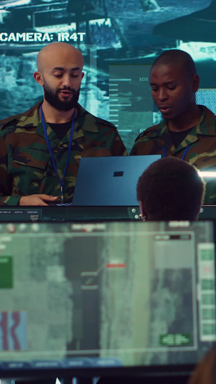 Military Soldiers Collaborating in High-Tech Control Room