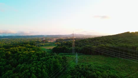 Stunning-4K-drone-footage-of-a-high-voltage-towers-at-sunset-background