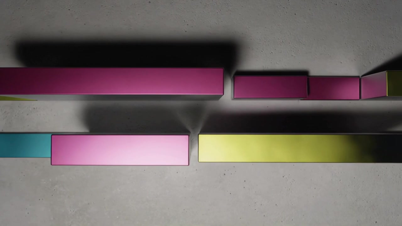 Sliding magenta, cyan, lime blocks moving after playback across studio floor, forming alignments