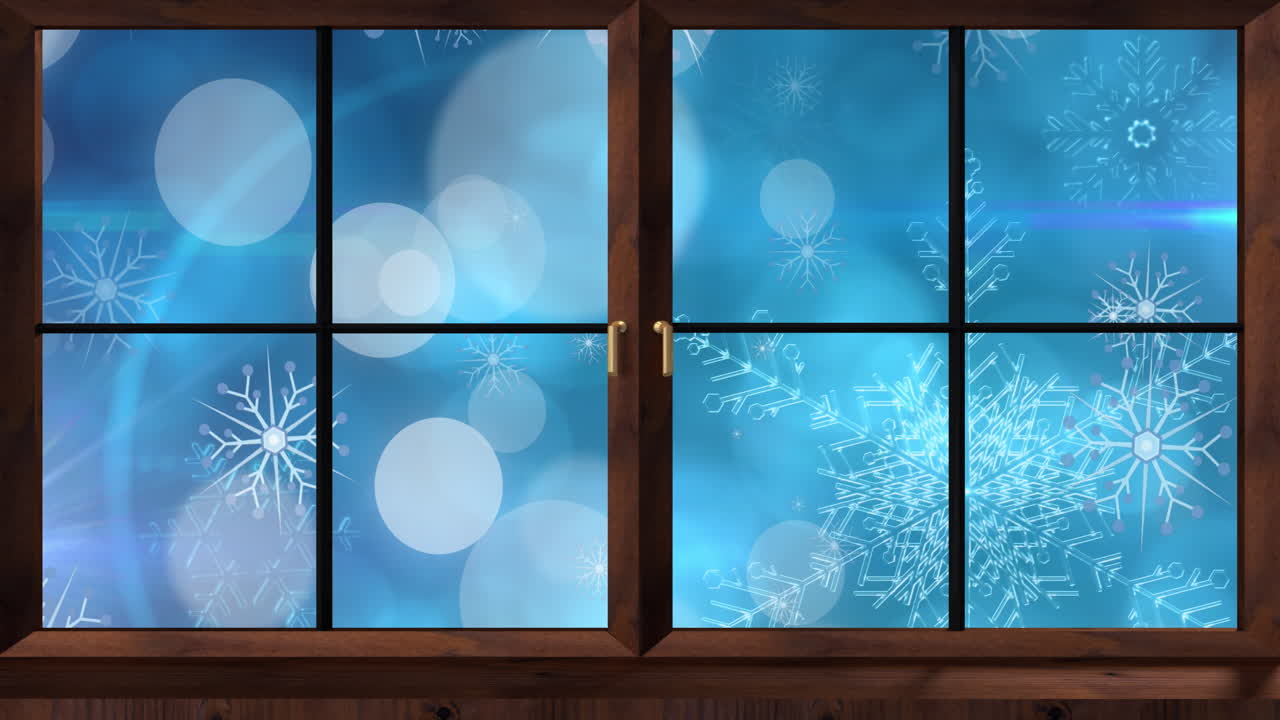 Animation af vindue over sne og lyspletter på blå baggrund