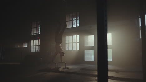 man performing exercise in industrial gym setting