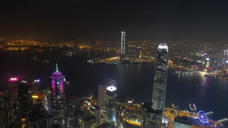 famosos edificios de la bahía de hong kong panorama aéreo nocturno 4k china