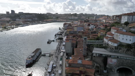 historical buildings of porto cityscape by douro river in portugal - aerial static