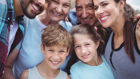 Animation-of-happy-family-embracing-outdoors