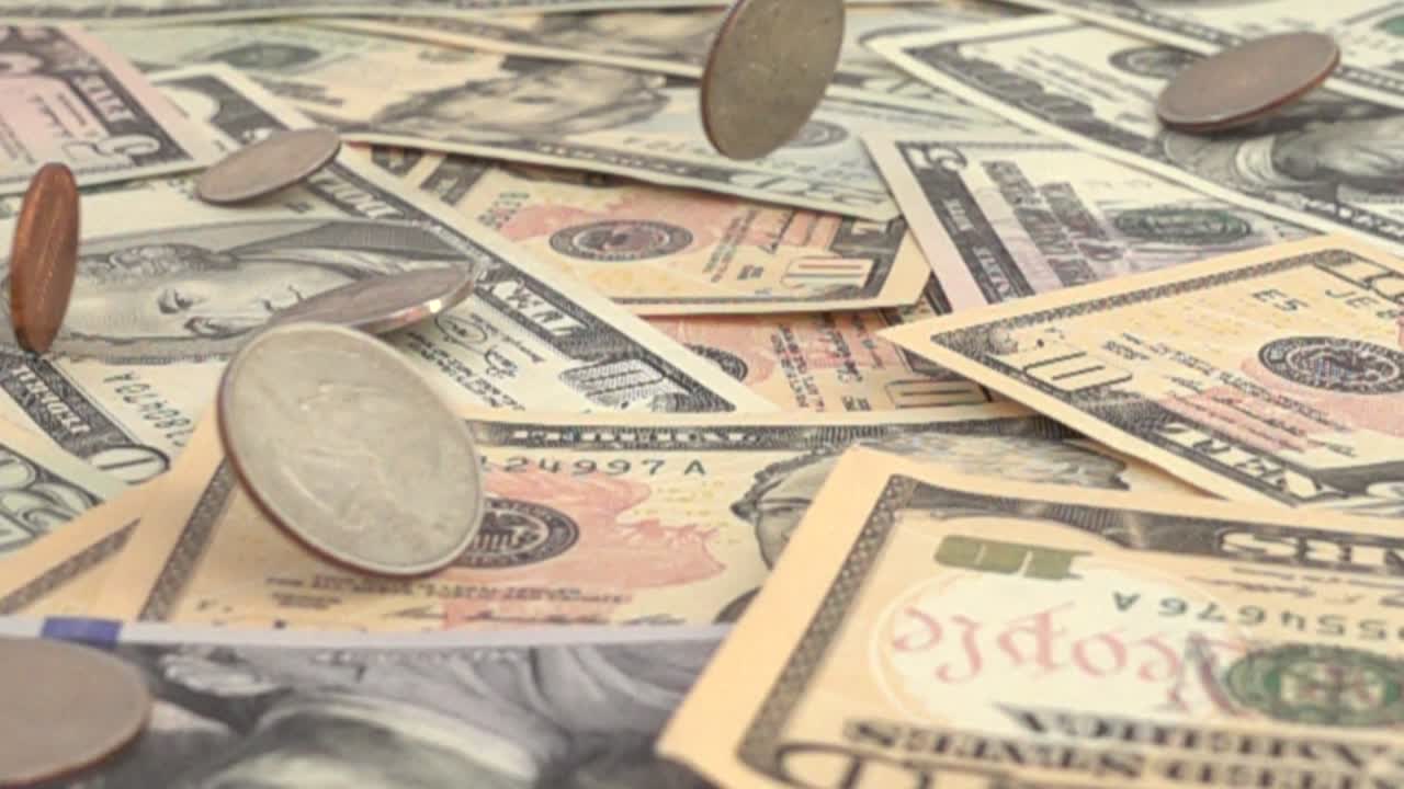 The coins of the USA falling for US dollars. Slow Motion. Shooting of money