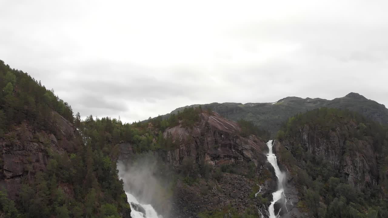 Beautiful Latefossen twin waterfalls cascading down mountain, Norway, aerial