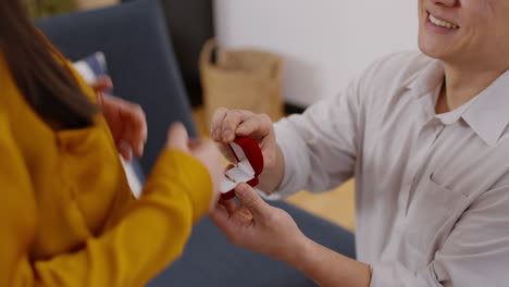 man proposing to woman with a ring