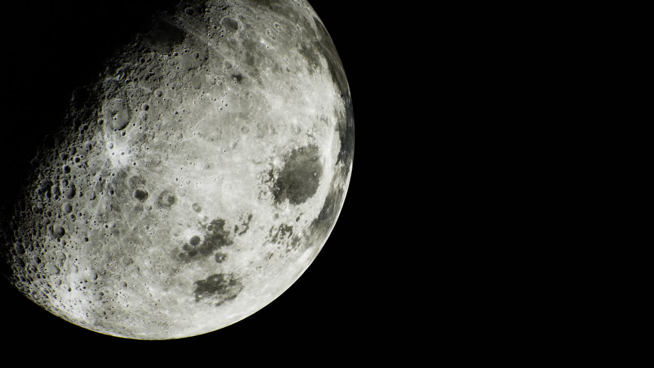 Night sky reveals a detailed view of the moons surface and craters