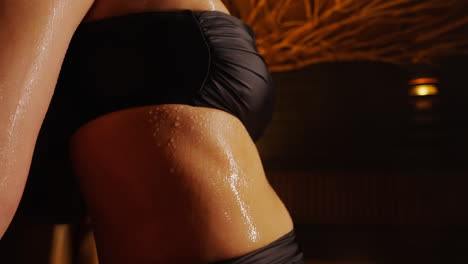 woman sweating in sauna