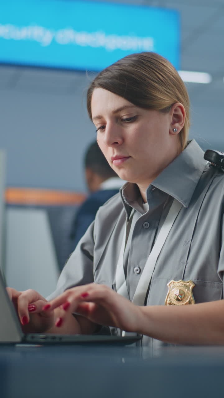 Airport Security Officer Working at a Desk