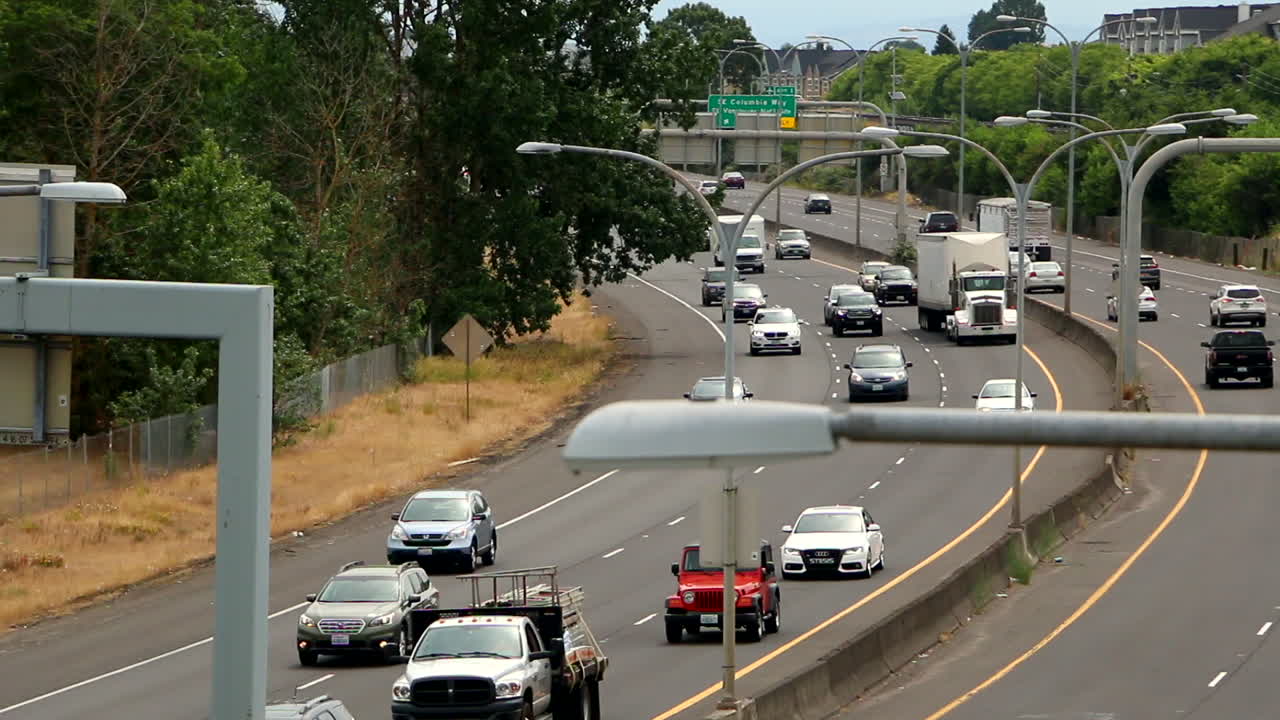 Traffic driving on highway during day in Washington