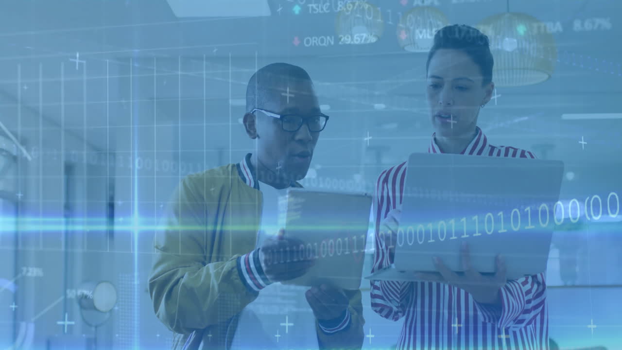 Two people reviewing documents with digital data processing animation overlay