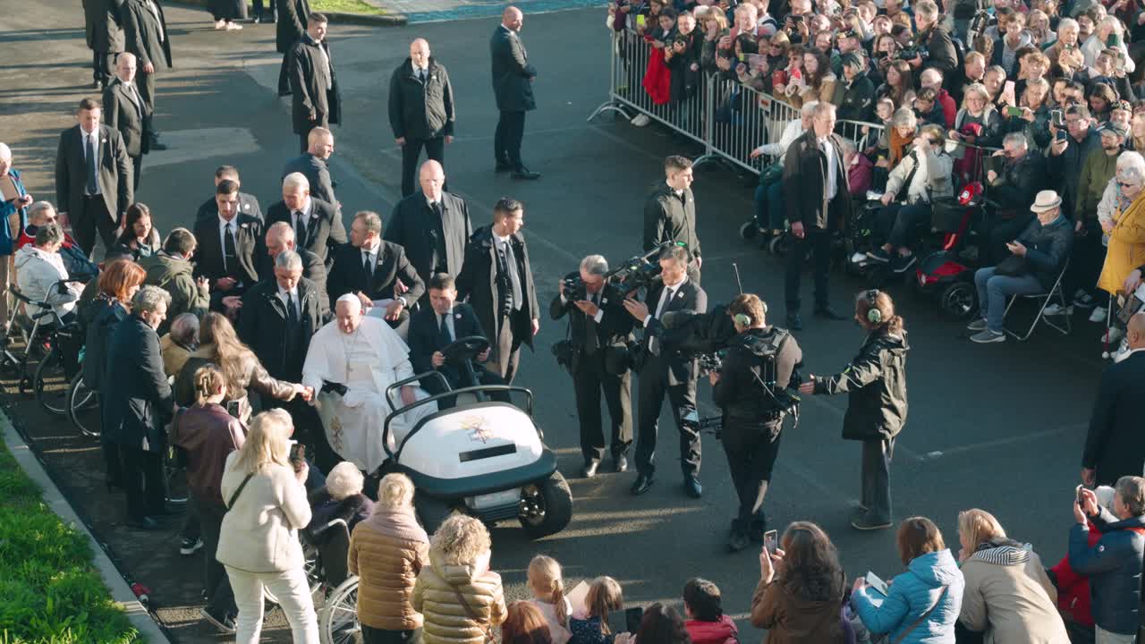 Pope Francis greeting people in popemobile - Louvain-la-Neuve, Belgium - Medium shot