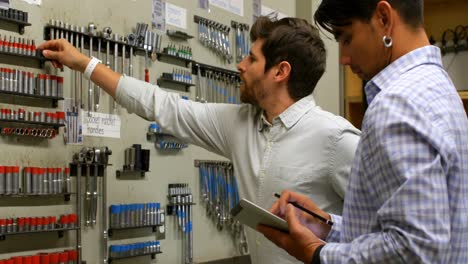 engineers checking spare tool in workshop 4k