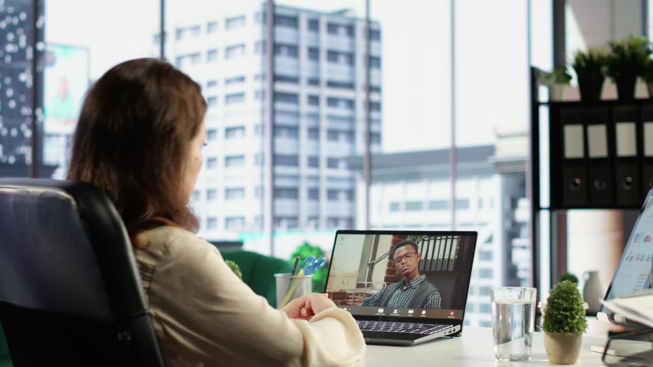 Female director discusses corporate social responsibility on videocall
