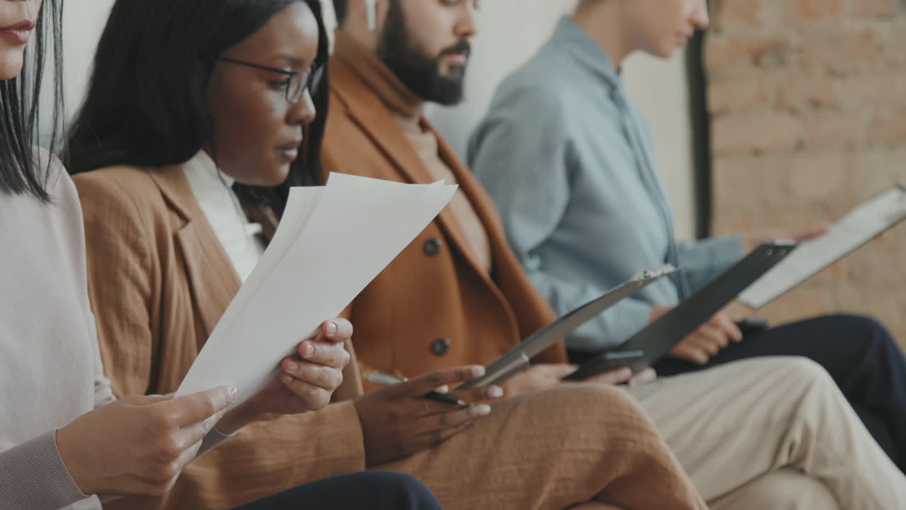 People Receiving Application Forms for Job Interview