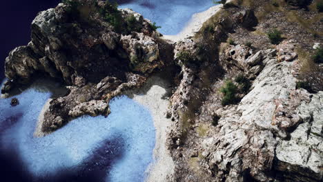 aerial view from flying drone of rocky island in atlantic ocean