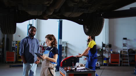 engineer showing customer car changes