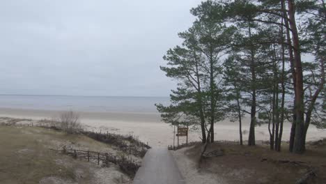 tilt shift from building wooden way on the beach to the horizon of the baltic see in latvia during the automn, november