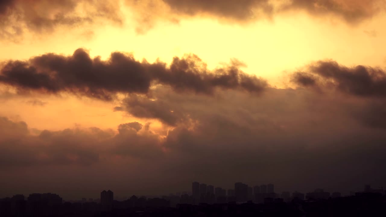 Time lapse sunset on the cloudy sky over city, Turkey