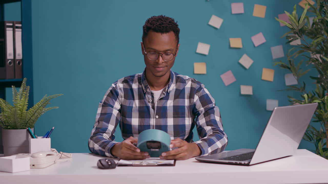 Punctual adult holding clock and being happy about work time
