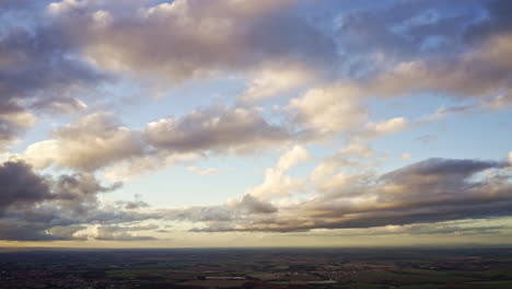 heavenly hyper lapse drone time lapse of soft clouds passing fast over in the sky