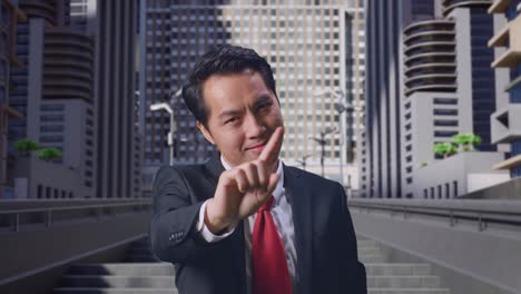asian business man showing stop, one finger gesture, taboo sign, standing in city
