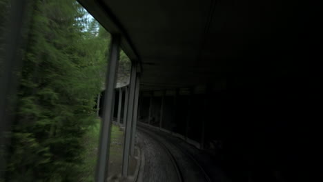 train moving slow through tunnel with column