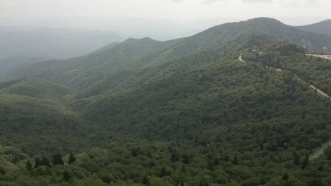 Foggy-Smoky-Mountain-aerial-over-heavily-forested-green-valley-trees