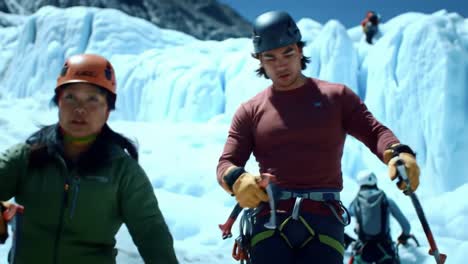 in a stunning mountain landscape, climbers prepare with gear for an exciting ice climbing challenge on a beautiful glacier. the atmosphere is vibrant and filled with anticipation and teamwork.
