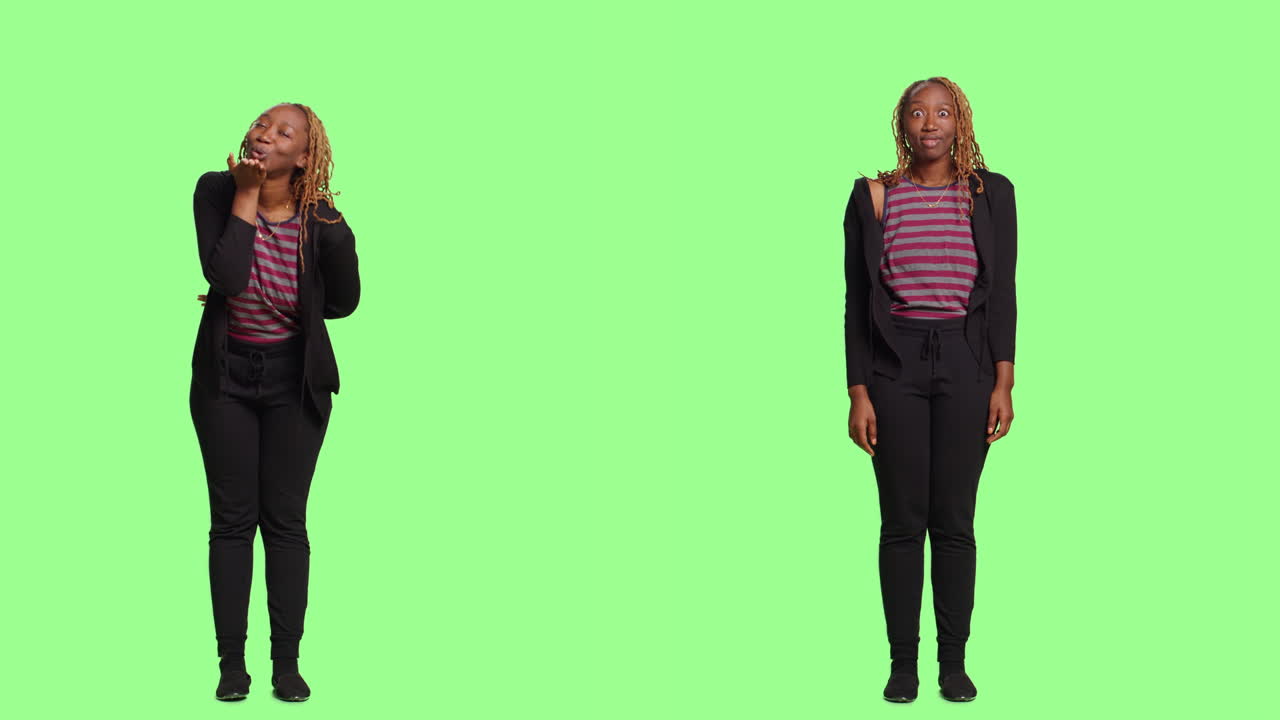 Studio shot of a happy woman expressing emotions on a green screen