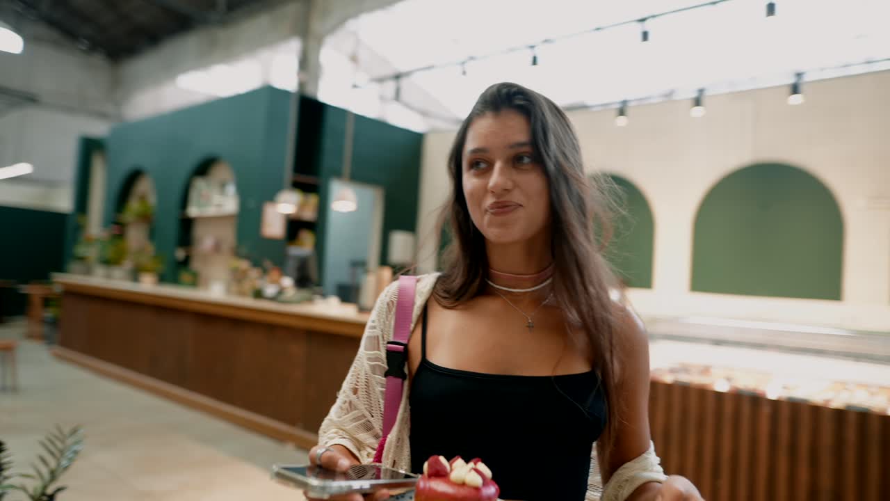 Woman with Donut in Cafe